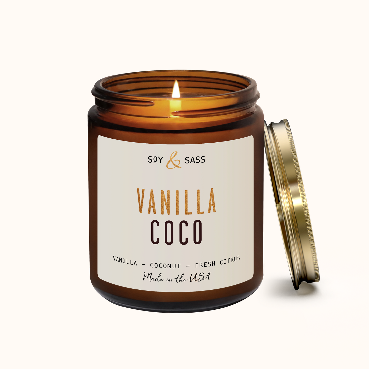 Vanilla Coco candle in an amber jar with a white label on a white background